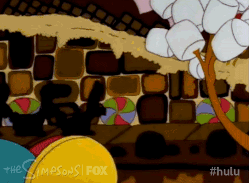 Gif de los Simpsons donde Homer recoge unos frutos secos que caen del cielo